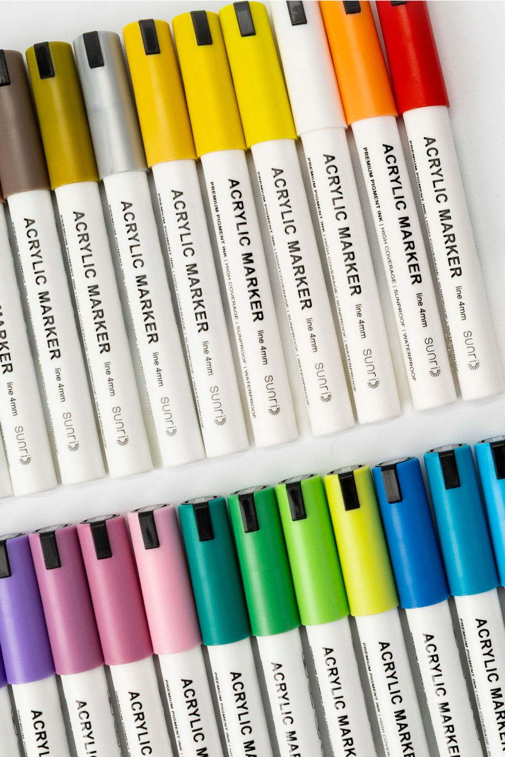 acrylic markers set with white barrels and assorted coloured caps arranged in rows