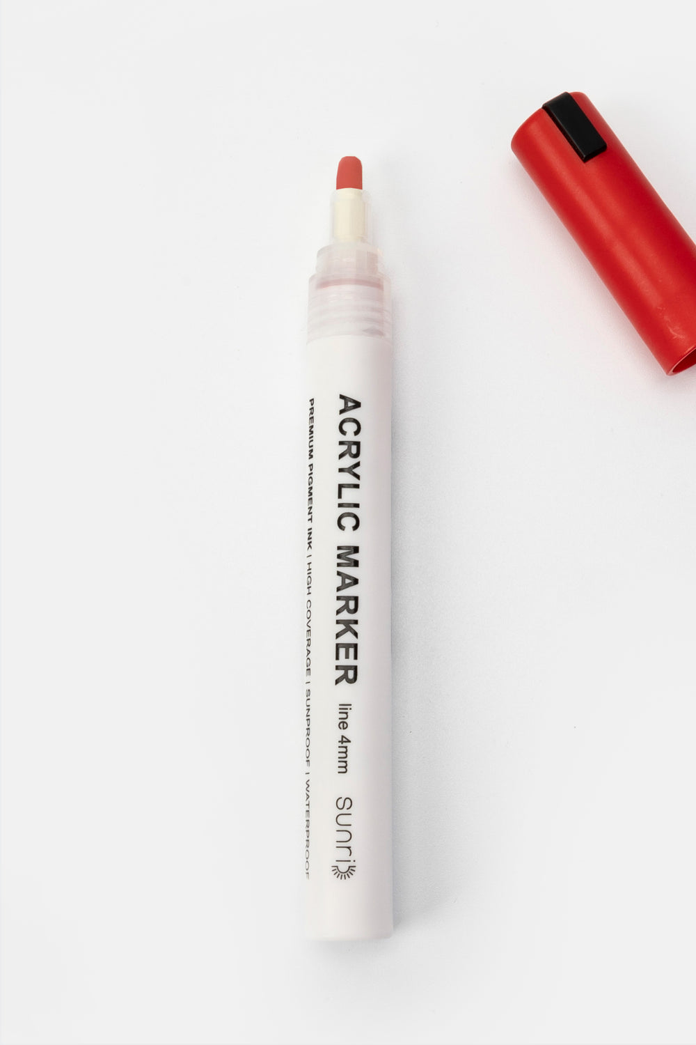 single acrylic marker with red cap removed showing white barrel and 4mm tip