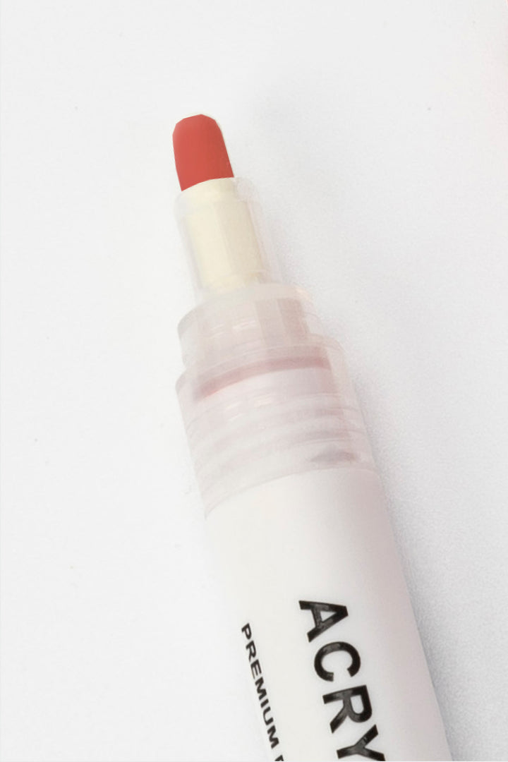 acrylic marker with red 4mm round nib tip visible close-up