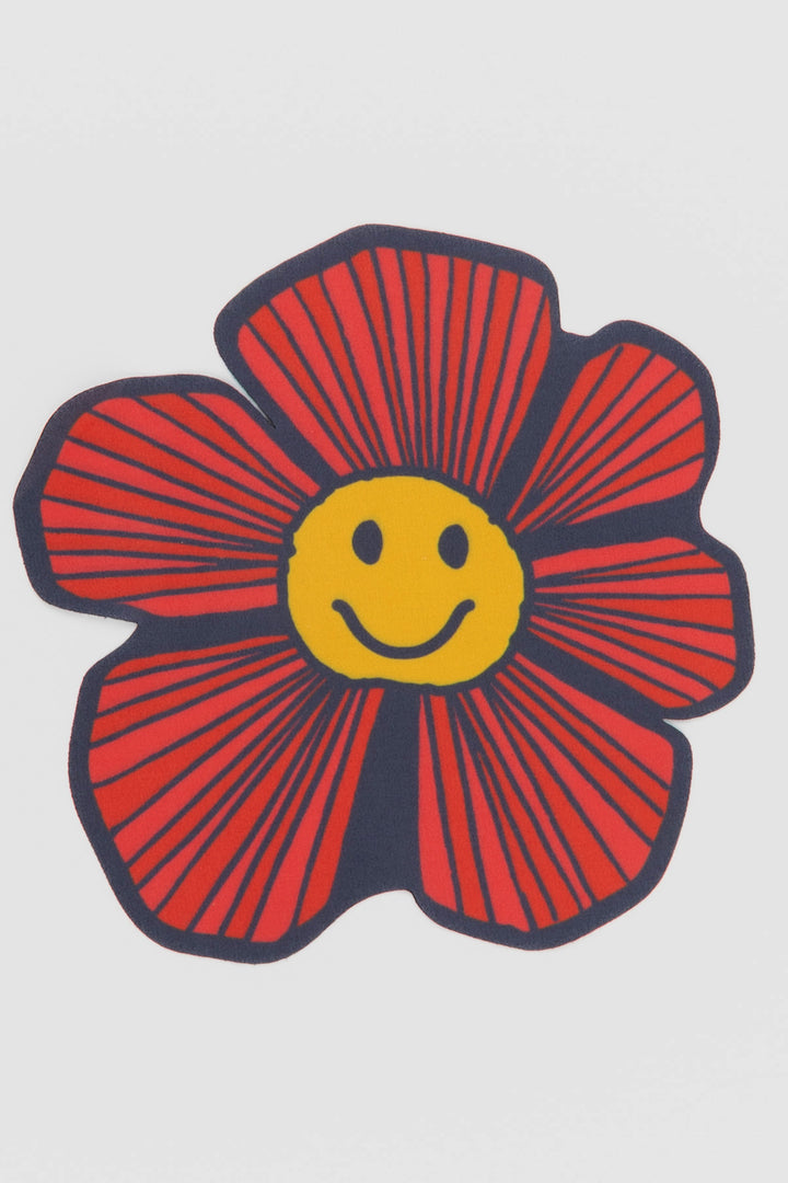 close-up of flower-shaped screen wipe shown on a white background
