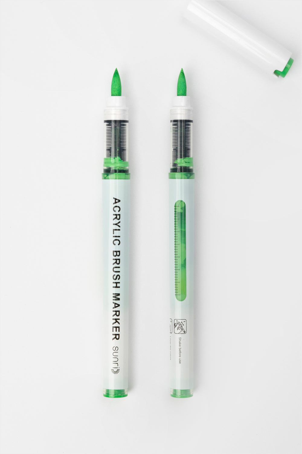 acrylic brush marker with green brush tip, transparent barrel