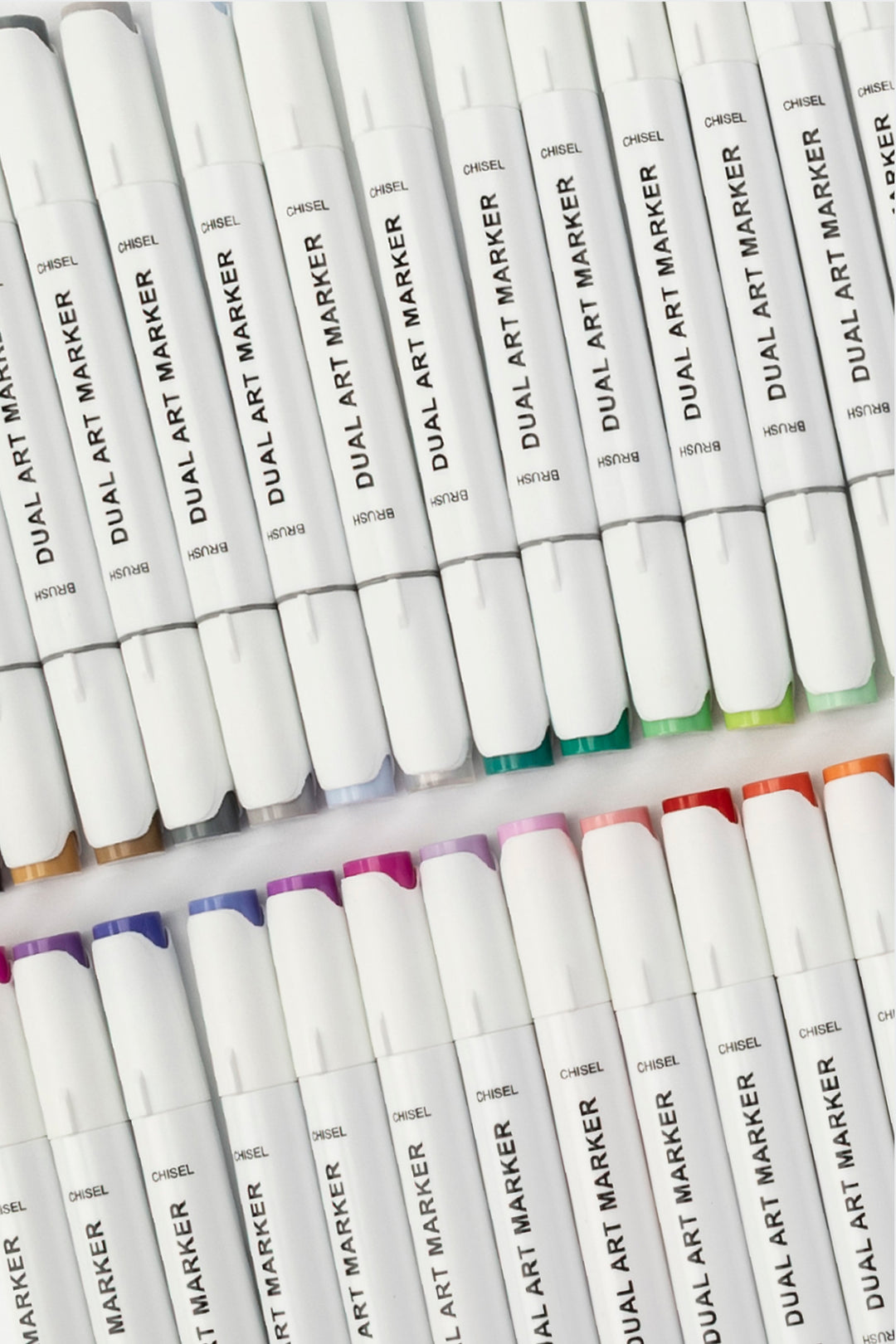 Dual tip art marker with brush tip and chisel tip visible, white body with black brush label and purple caps