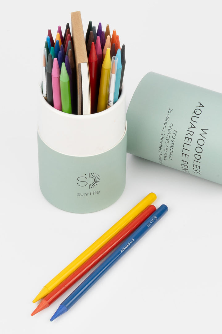 Set of colored pencils in a cylindrical container on a white background