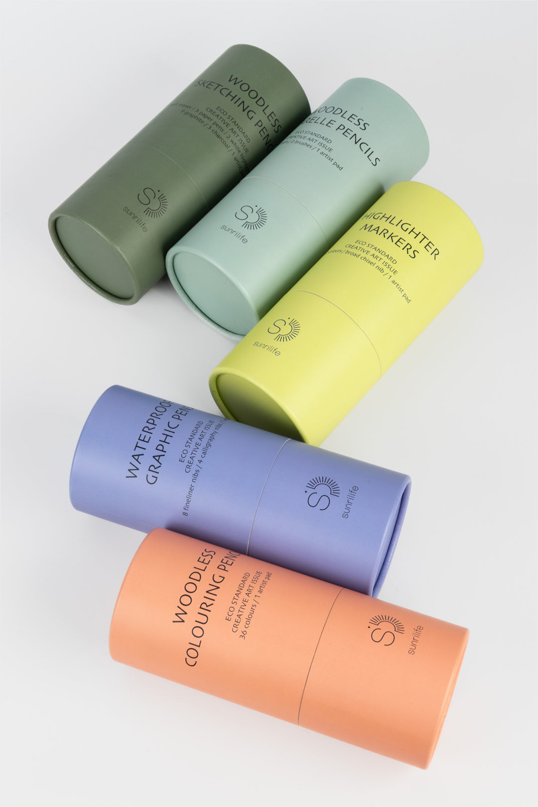 Five recycled cardboard tubes arranged together including the green aquarelle pencils tube
