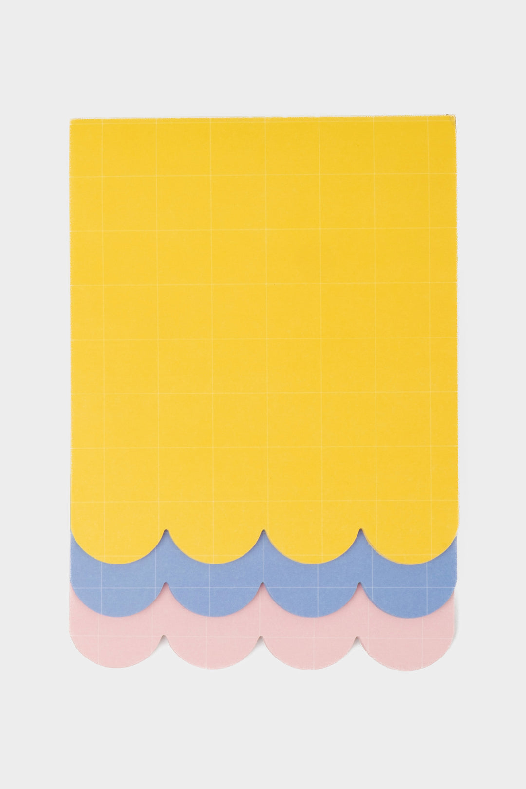 front view of three layer scalloped notepad in yellow, blue and pink with grid pattern
