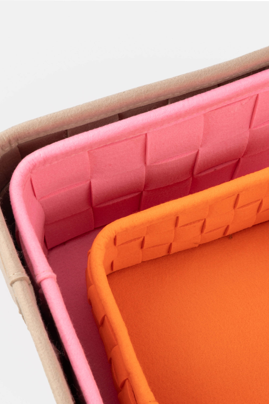 close-up of the woven felt texture and layered construction of the storage boxes

