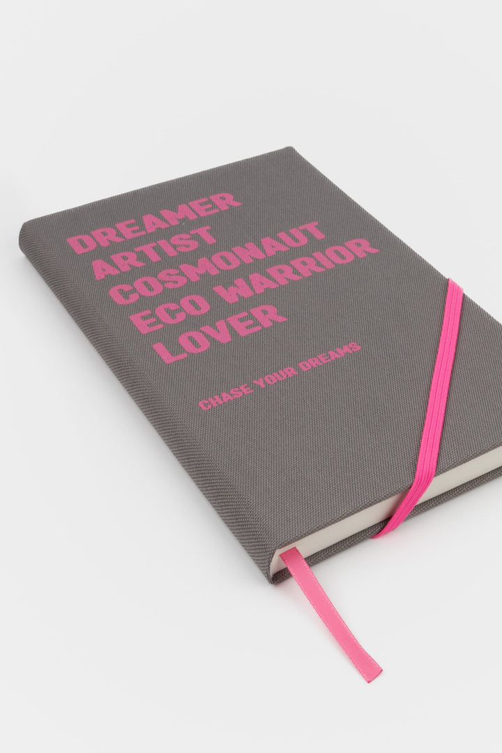 Grey A5 diary with pink text pink elastic band and pink ribbon marker
