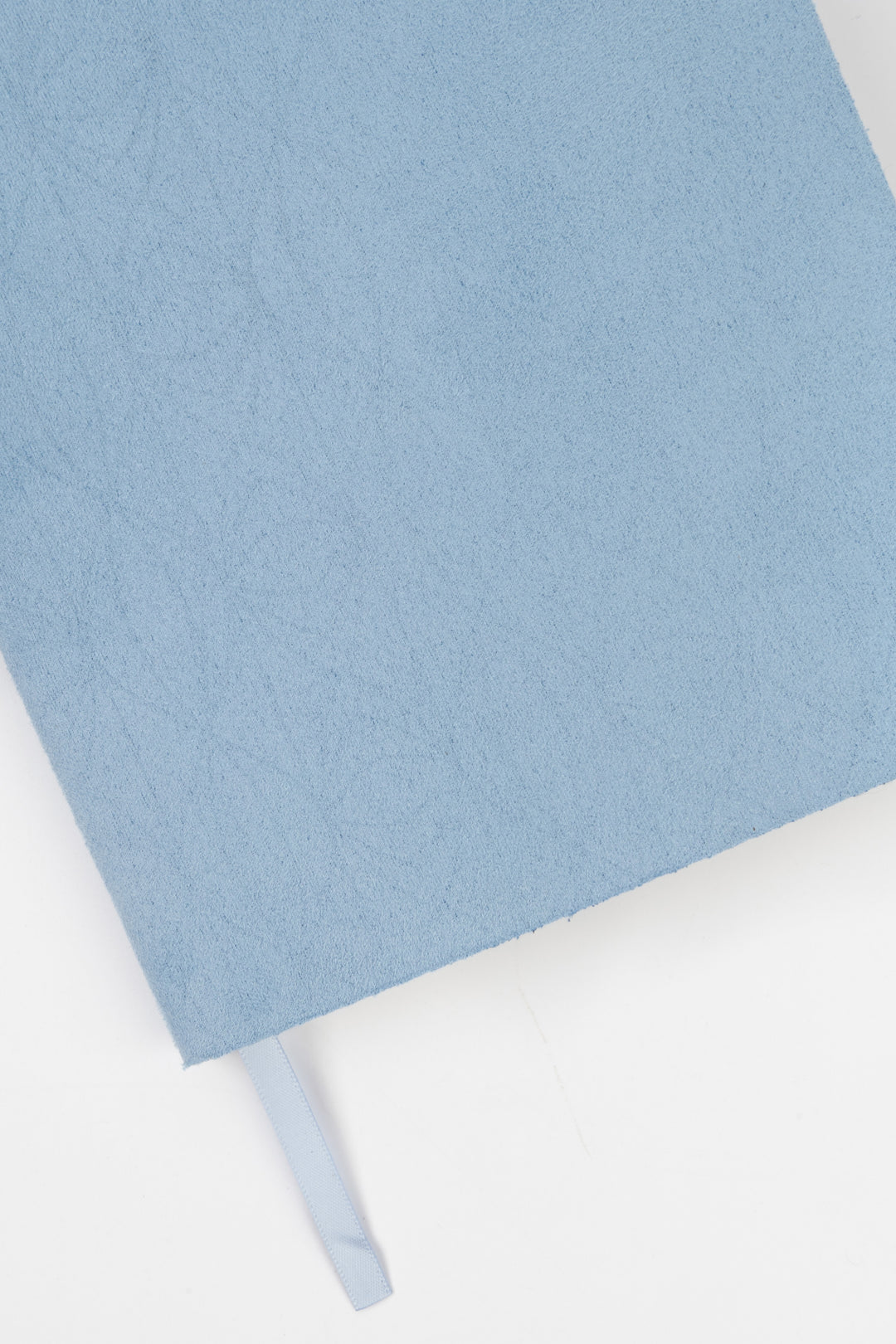 detail of blue faux suede  flex-cover diary with embossed pattern
