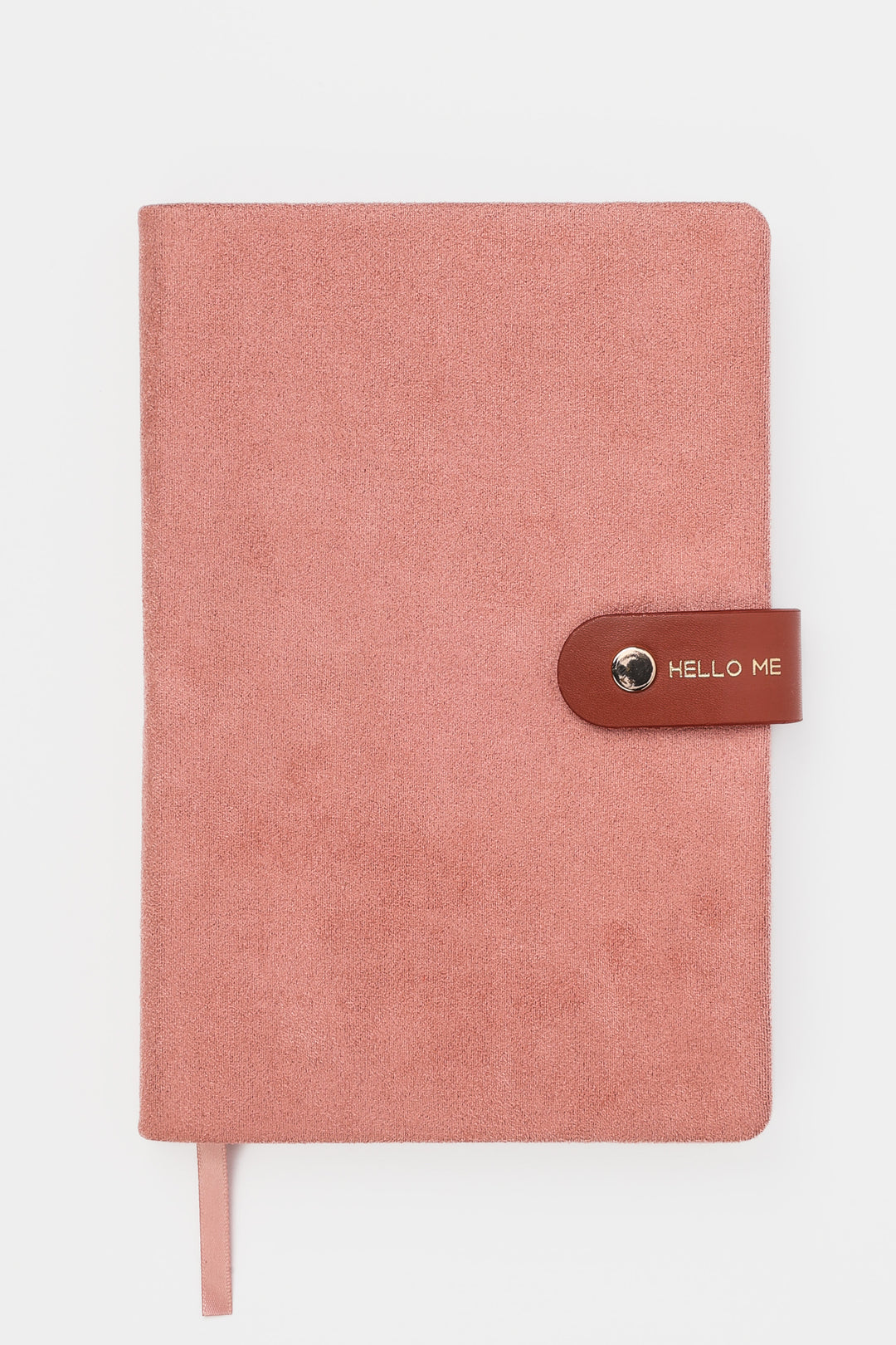 front view of a pink faux-suede notebook with a rounded flap closure with gold button detail and hello me text