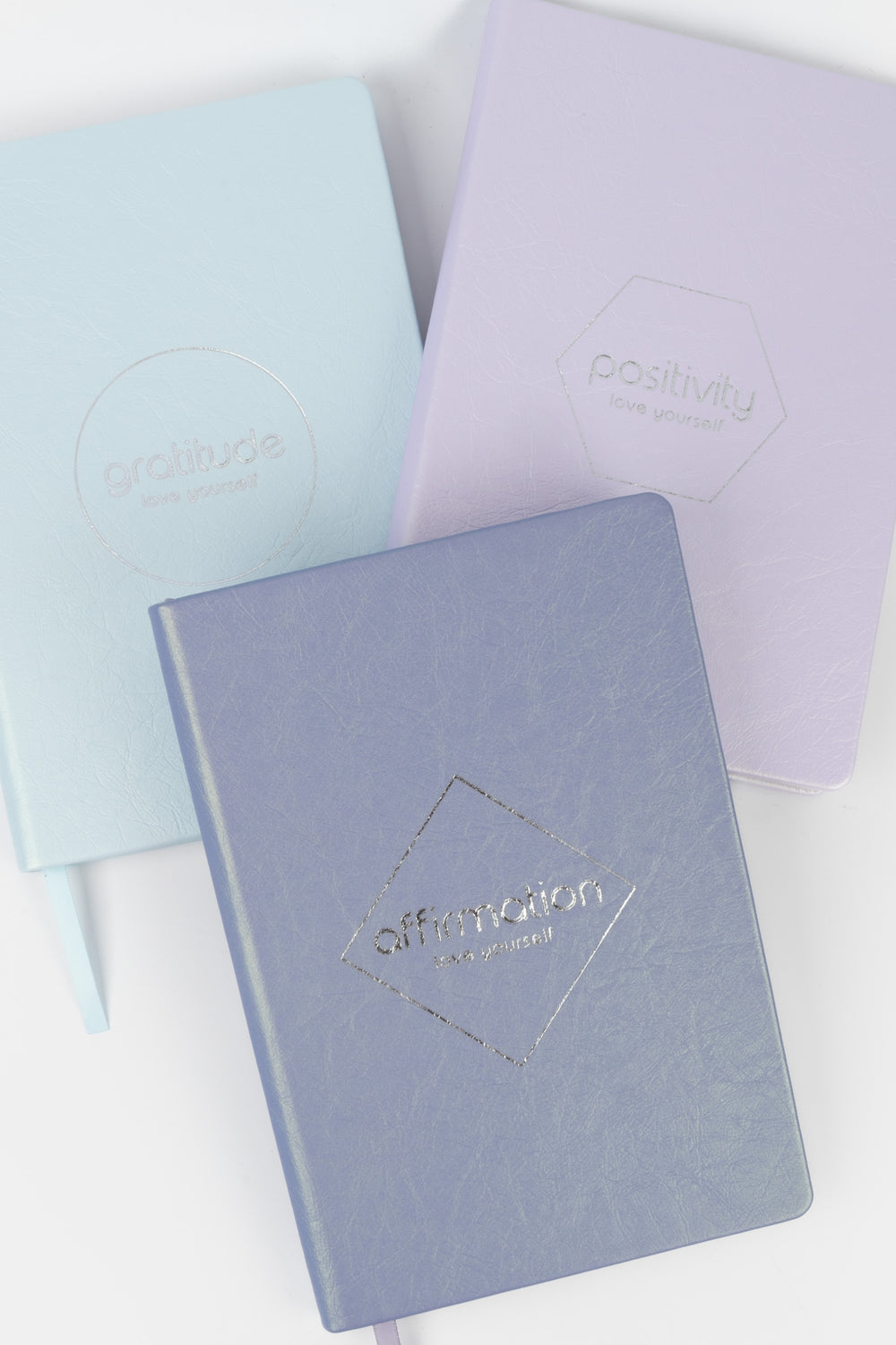 3 Love yourself pastel-coloured notebooks with embossed themes 