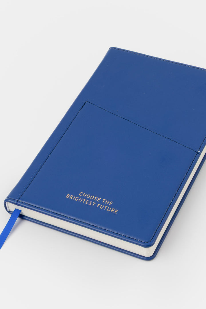 A5 blue PU leather notebook shown angled with visible front pocket and satin page marker
