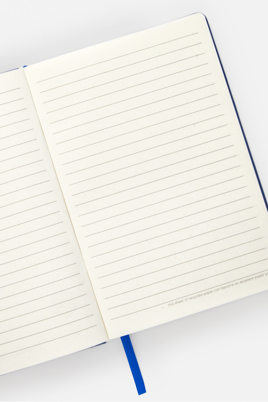 open A5 notebook with ruled pages and  satin marker visible

