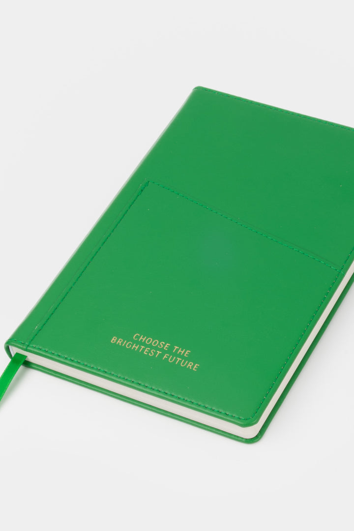 A5 green PU leather notebook shown angled with visible front pocket and satin page marker
