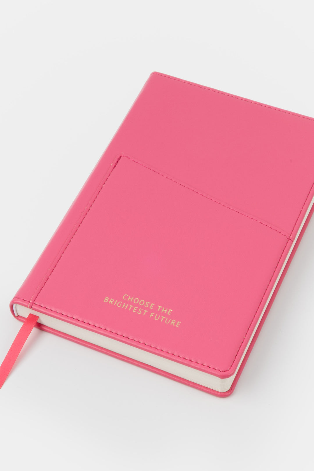 A5 pink PU leather notebook shown angled with visible front pocket and satin page marker