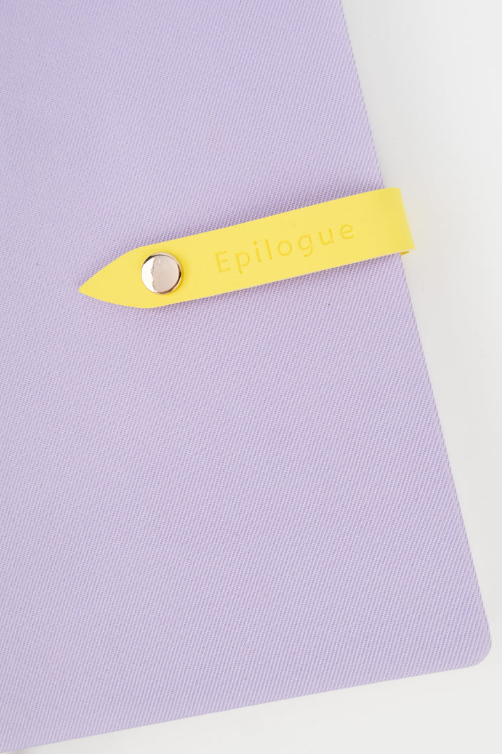 Purple journal with a yellow tab labeled 'Epilogue' on a white background