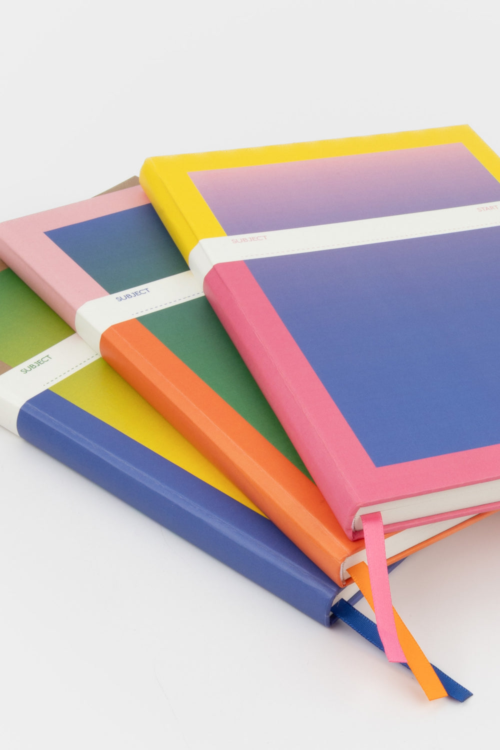 stack of A5 notebooks with assorted gradient covers