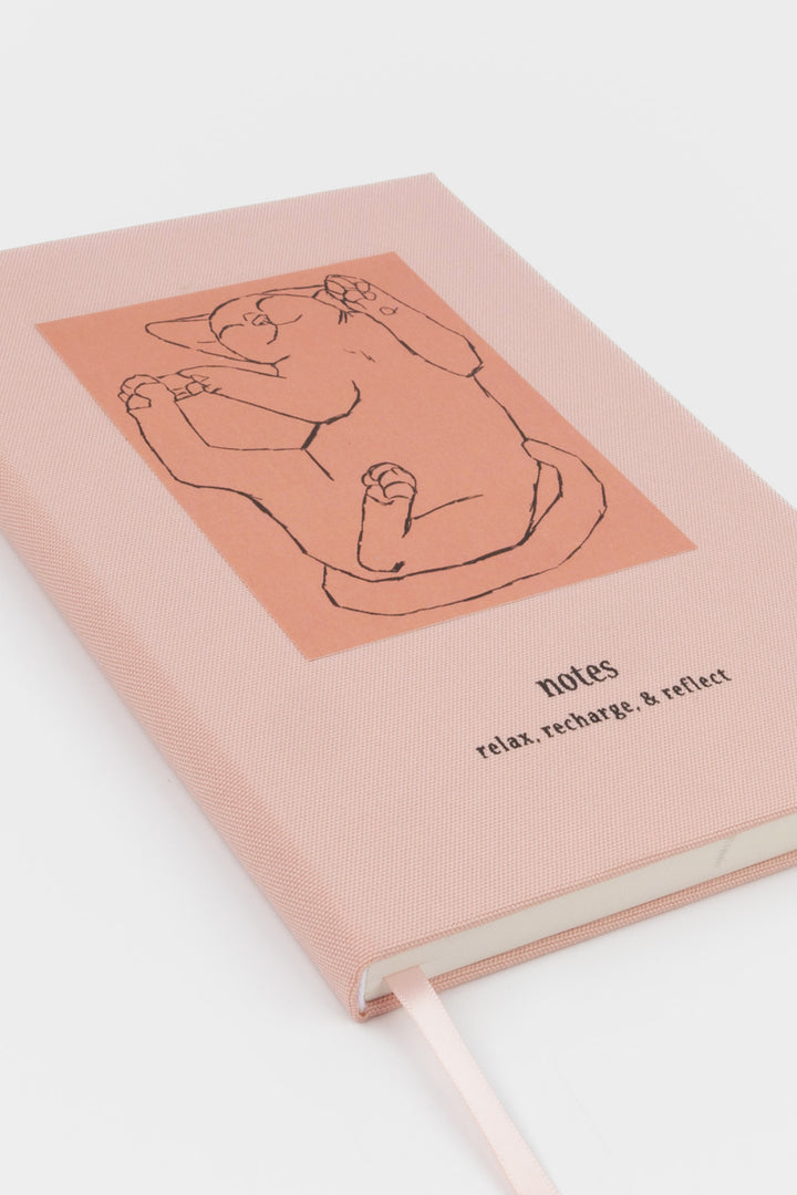Pink relax recharge and reflect notebook with a cat illustration 