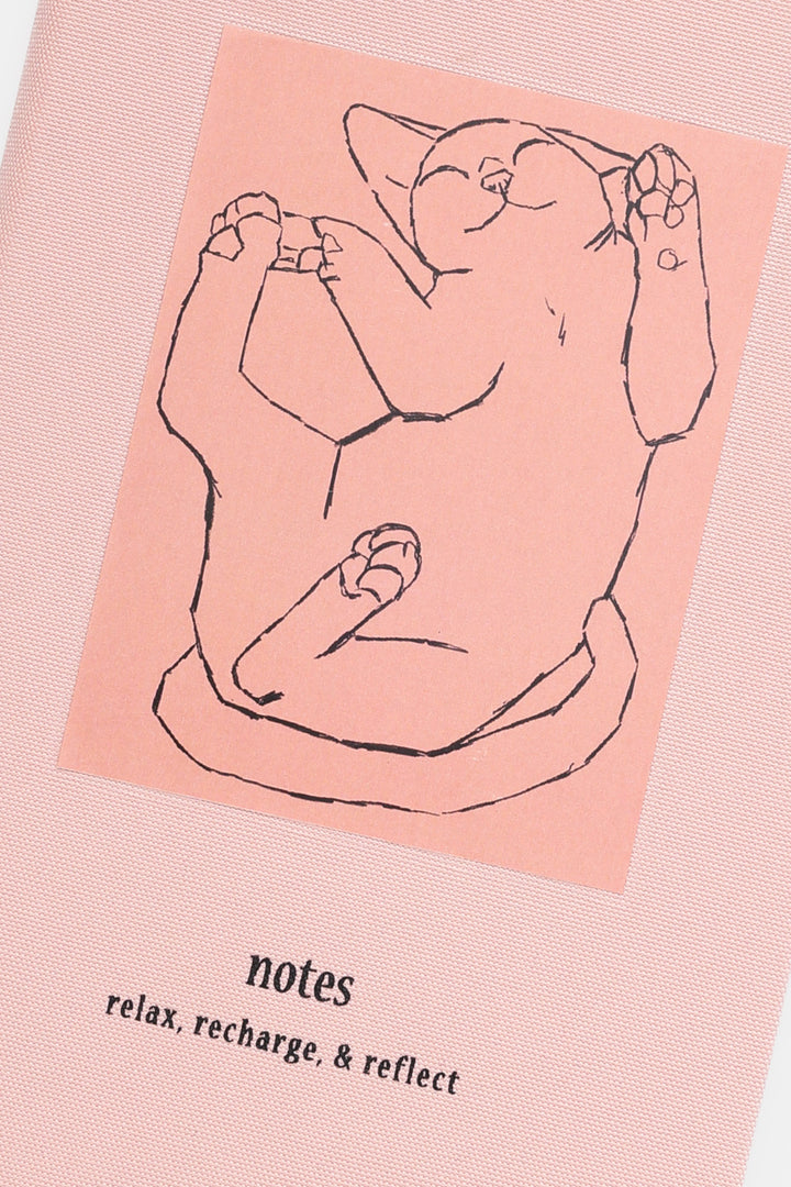 Pink relax recharge and reflect notebook with a cat illustration 