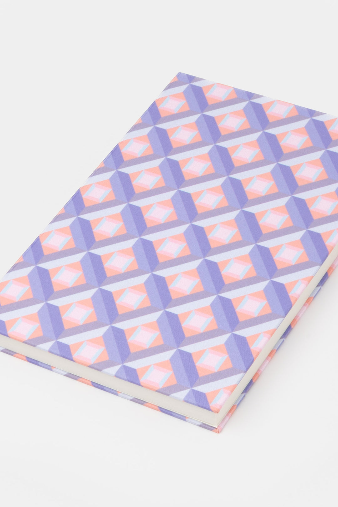 A5 hardcover notebook with pink and purple optical geometric print shown closed
