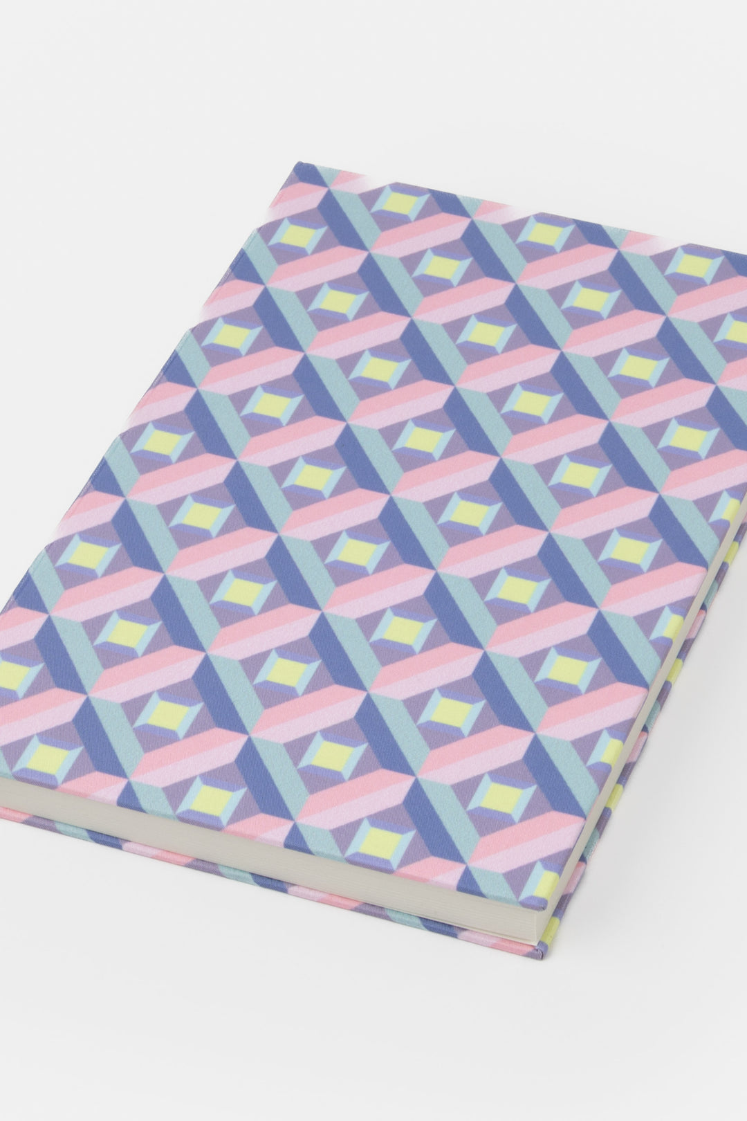 A5 hardcover notebook with pink and purple optical geometric print shown closed
