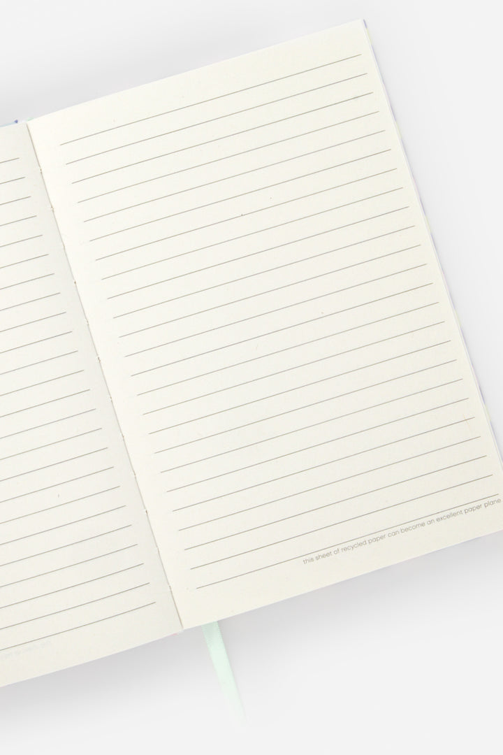 Open A5 notebook with ruled recycled paper pages and ribbon marker visible