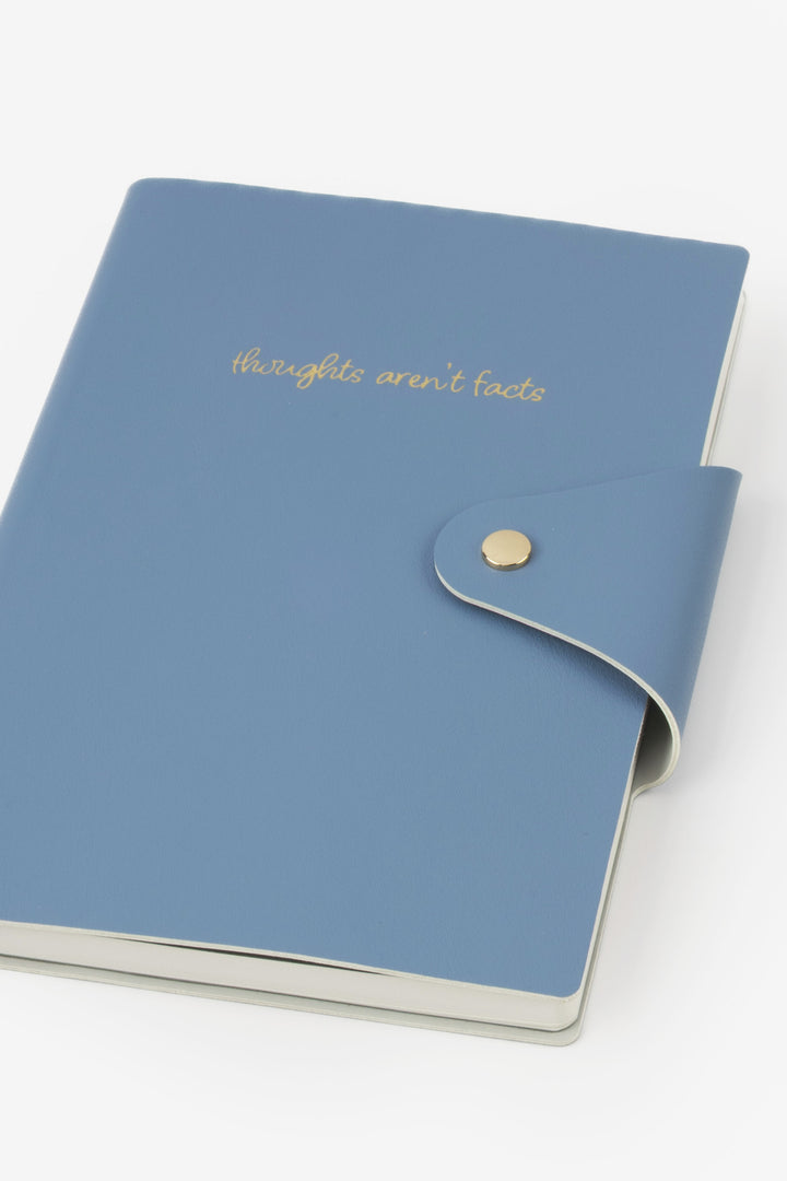 Blue notebook with gold text on a white background