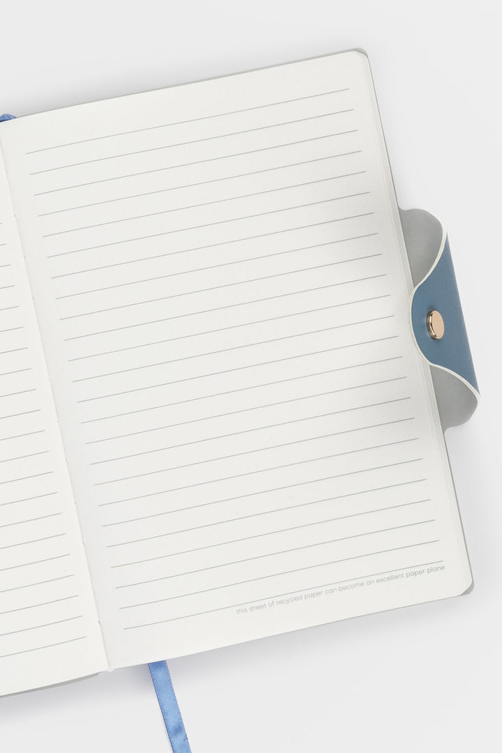 Open notebook with lined pages on a white background