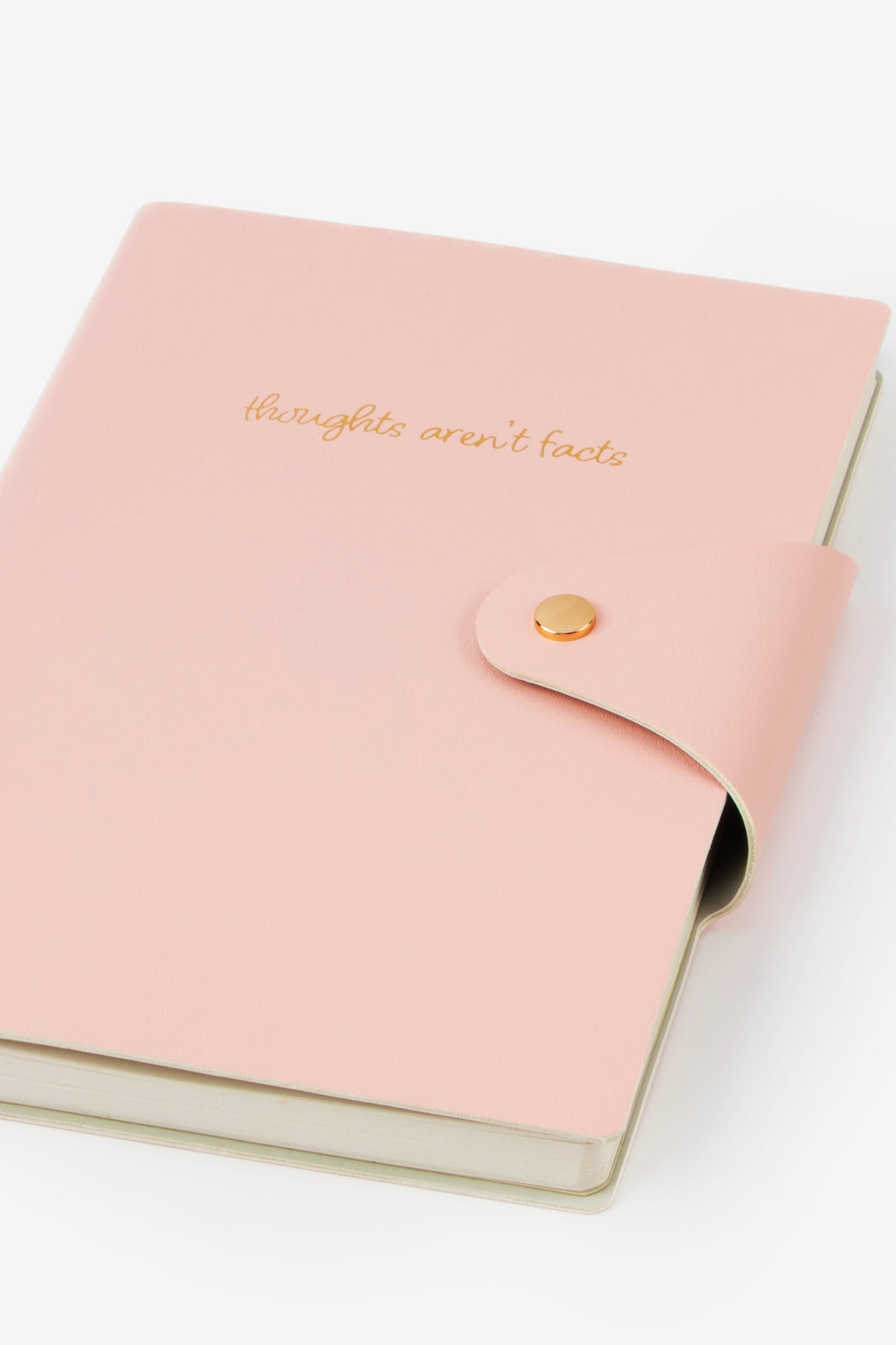 Pink notebook with gold text and button on a white background