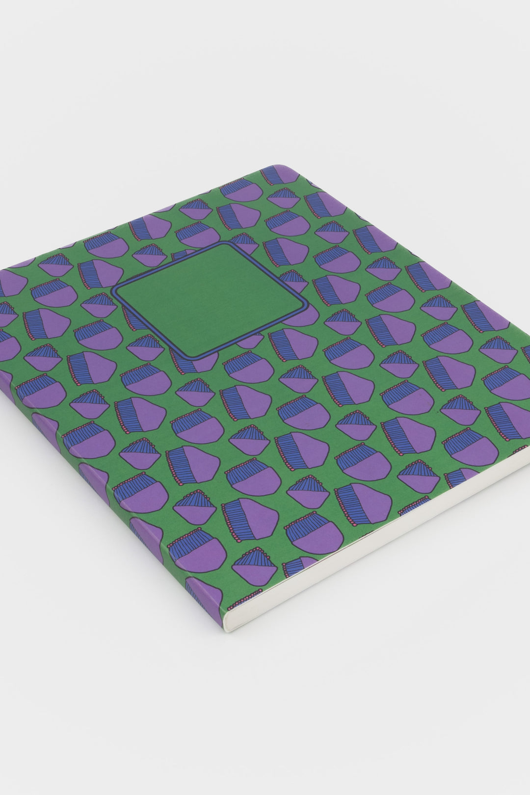 Notebook with purple geometric pattern on green cover