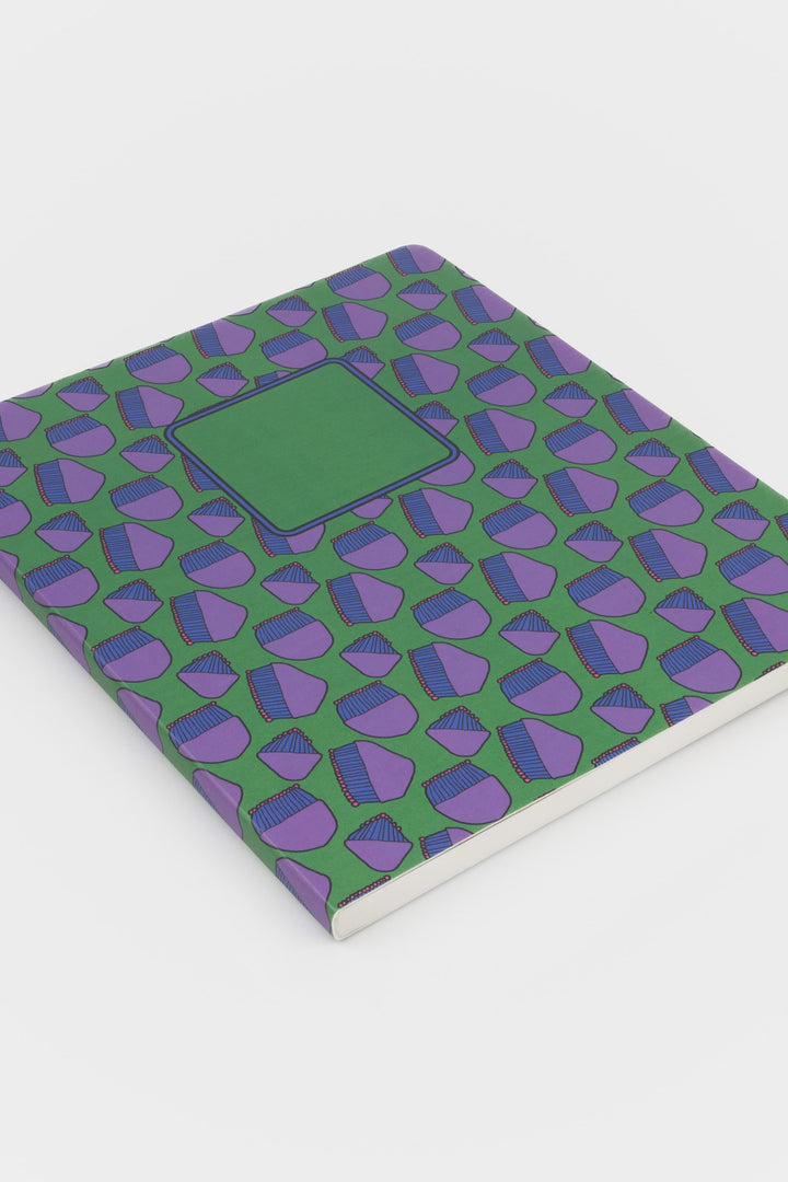 Notebook with purple geometric pattern on green cover