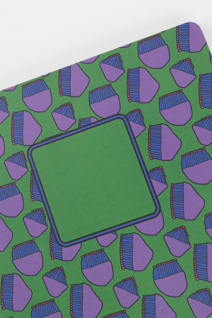 Notebook with purple geometric pattern on green cover