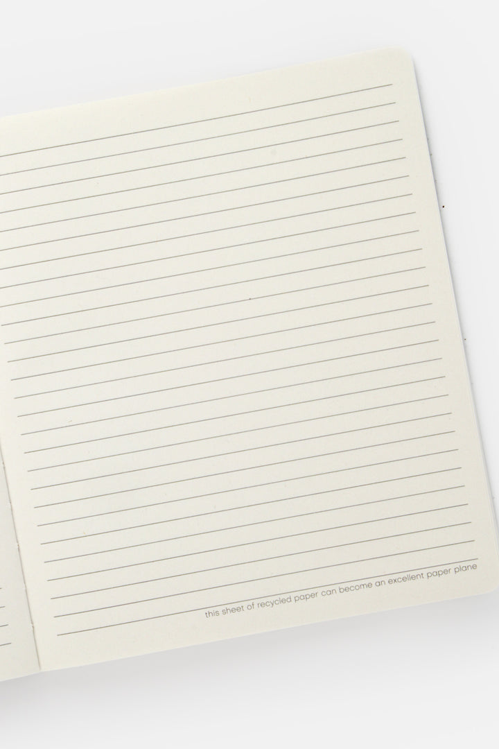 Open notebook with lined pages on a white background