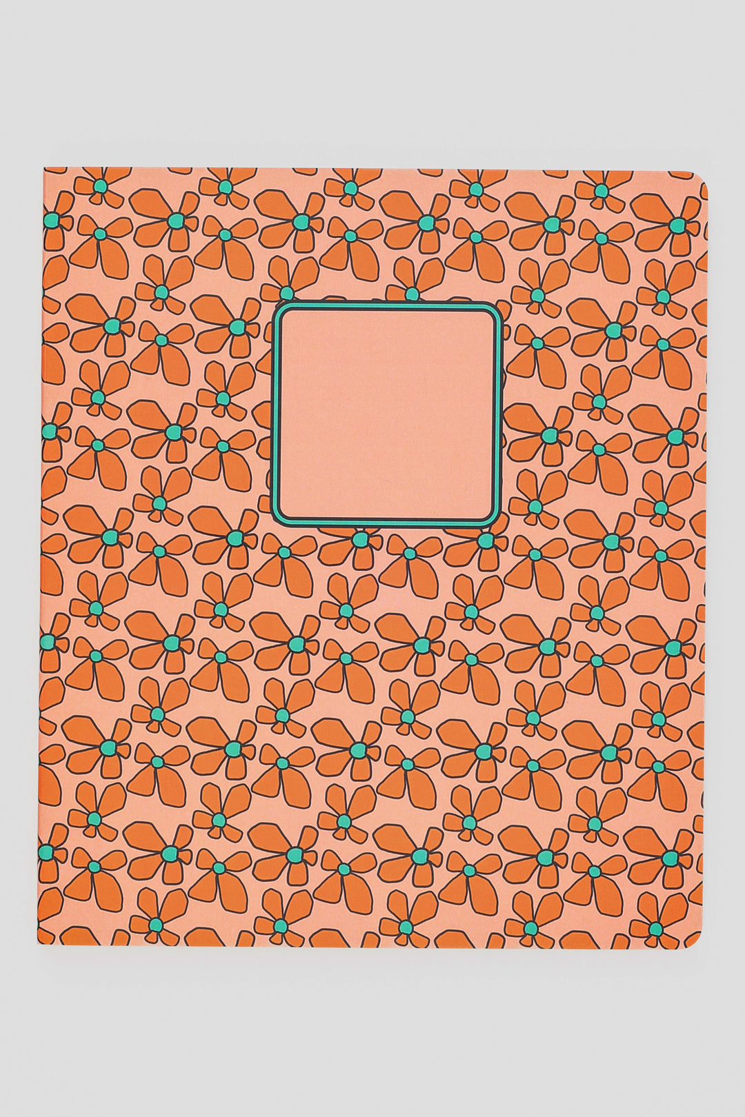 Notebook with a floral pattern on a peach background