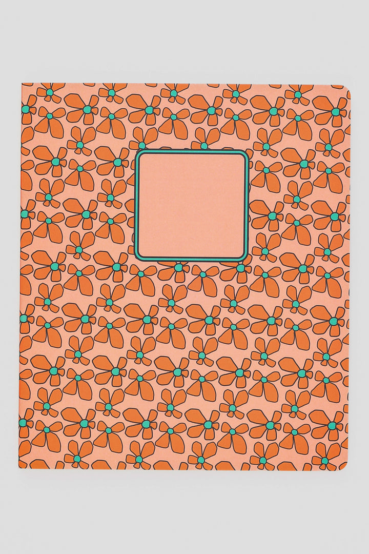 Notebook with a floral pattern on a peach background