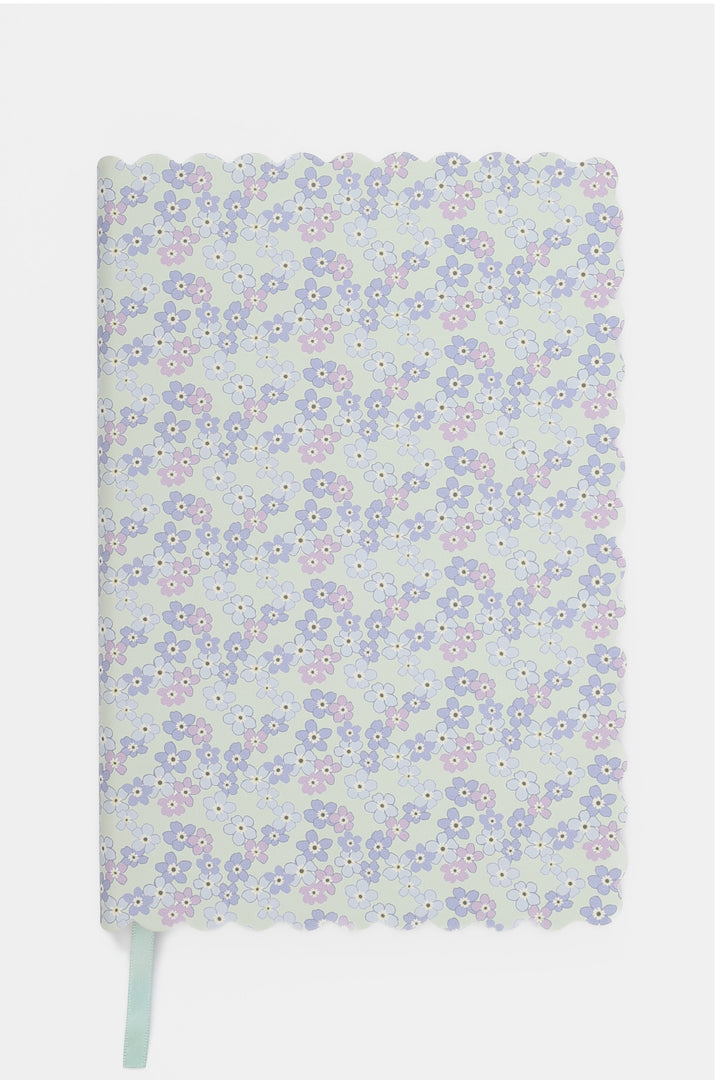 front view of a scalloped-edge notebook with an all-over small flower pattern in pastel colours