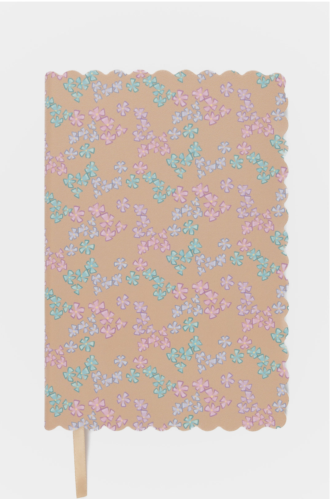 front view of a scalloped-edge notebook with an all-over small flower pattern in pastel colours