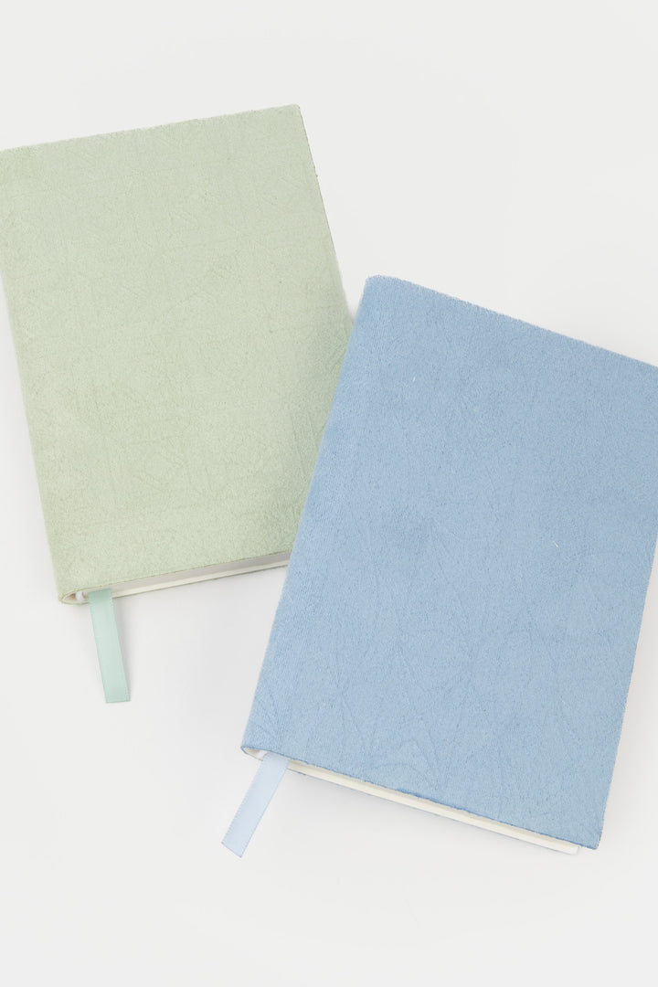 green and blue faux suede  flex-cover diaries with embossed patterns

