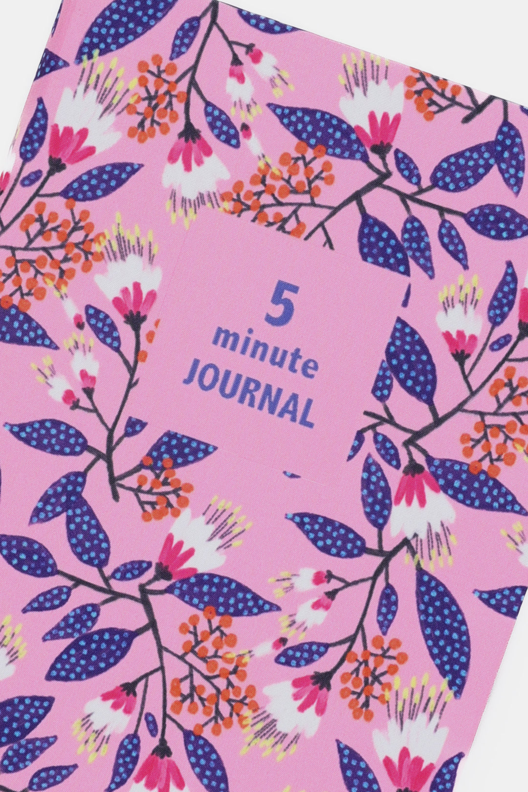 close up of pink floral fabric cover showing five minute journal title block

