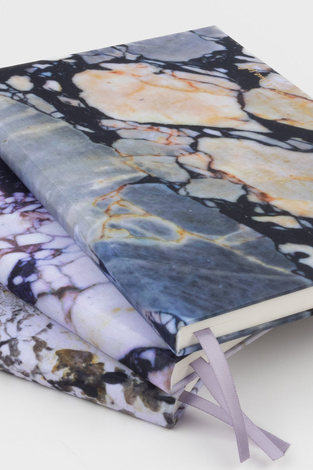 3 A5 diaries with fabric covers featuring natural stone print, stacked