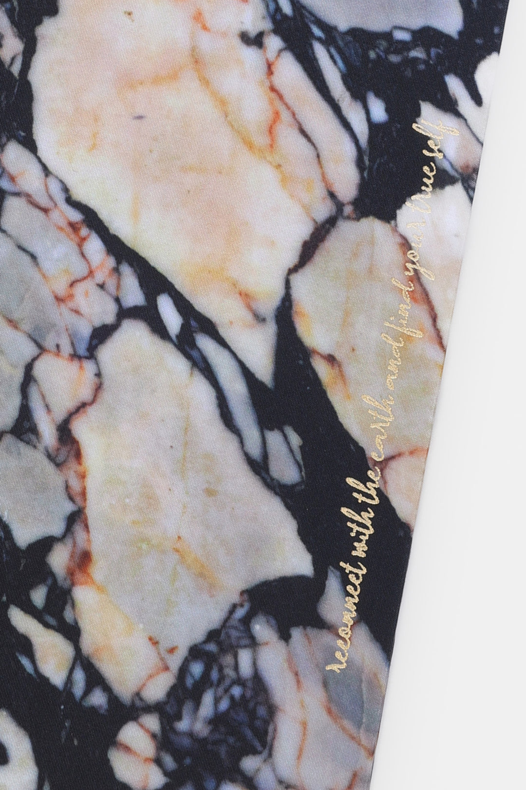 Close up of A5 diary fabric cover showing natural stone print detail with gold foil text