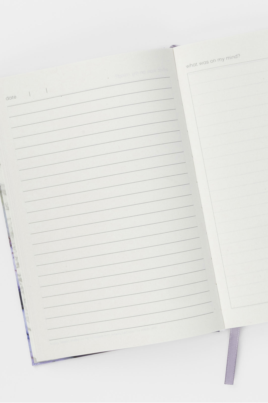 Open A5 diary showing lined and blank journal pages and ribbon bookmark