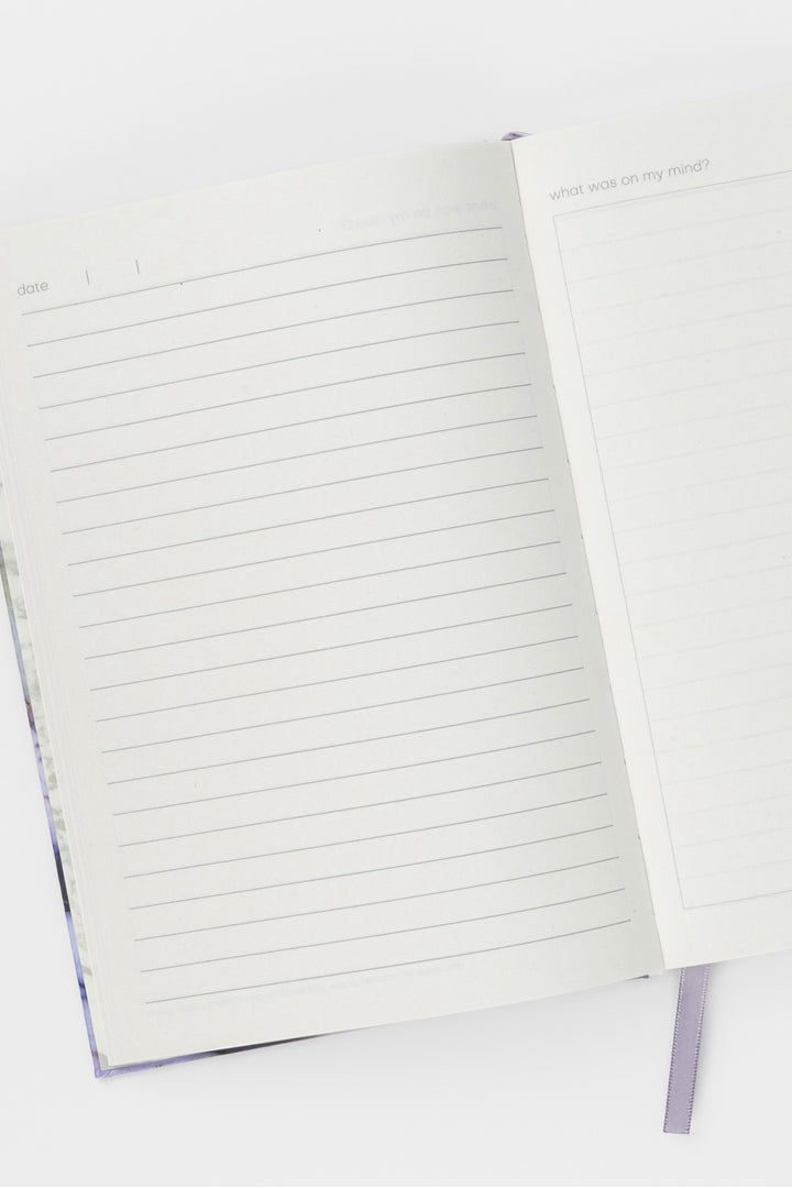 Open A5 diary showing lined and blank journal pages and ribbon bookmark