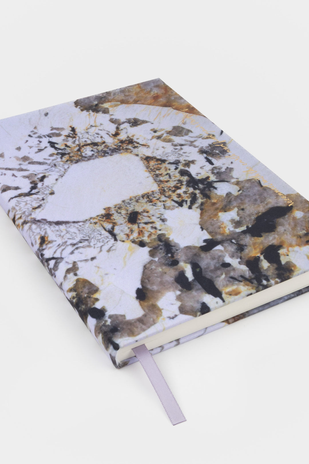 A5 diary angled view showing natural stone print cover and spine with ribbon bookmark