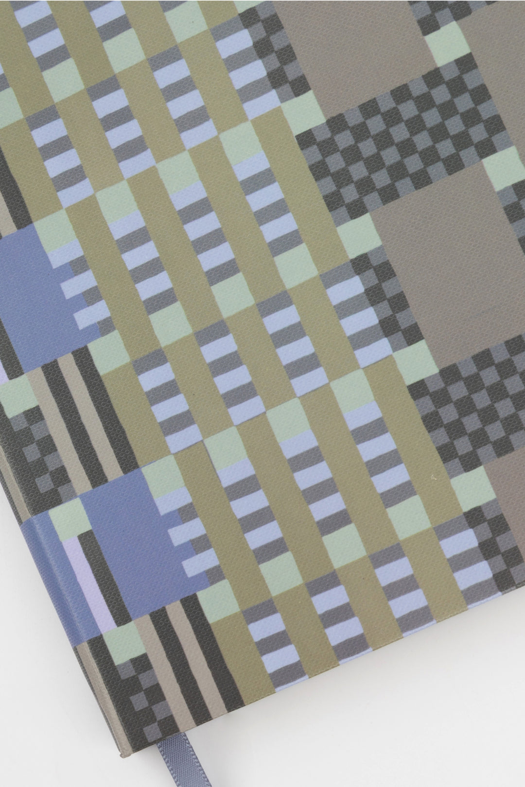 A5 journal cover detail showing blue grey and green geometric pattern fabric texture