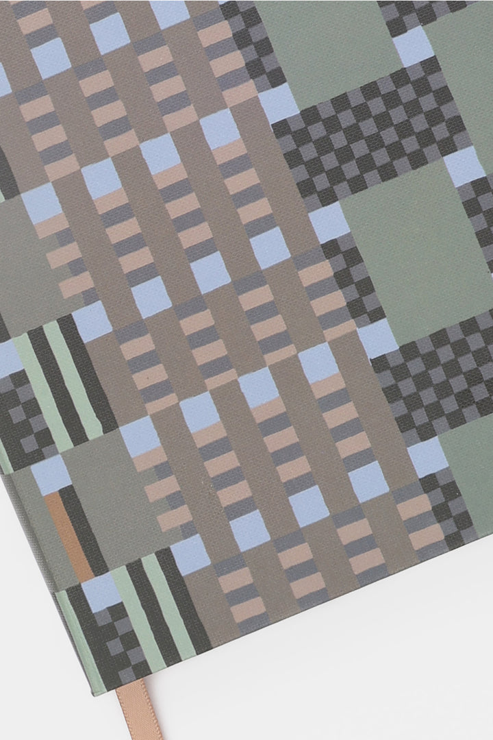 A5 journal cover detail showing green grey and green geometric pattern paper texture