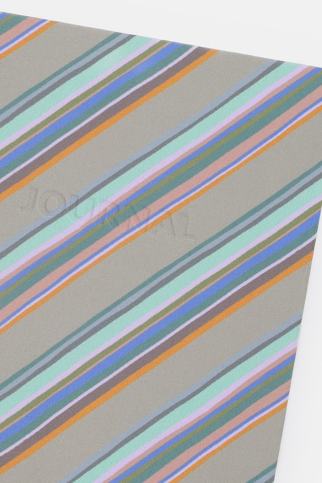 angled close-up of grey diagonal stripe fabric cover
