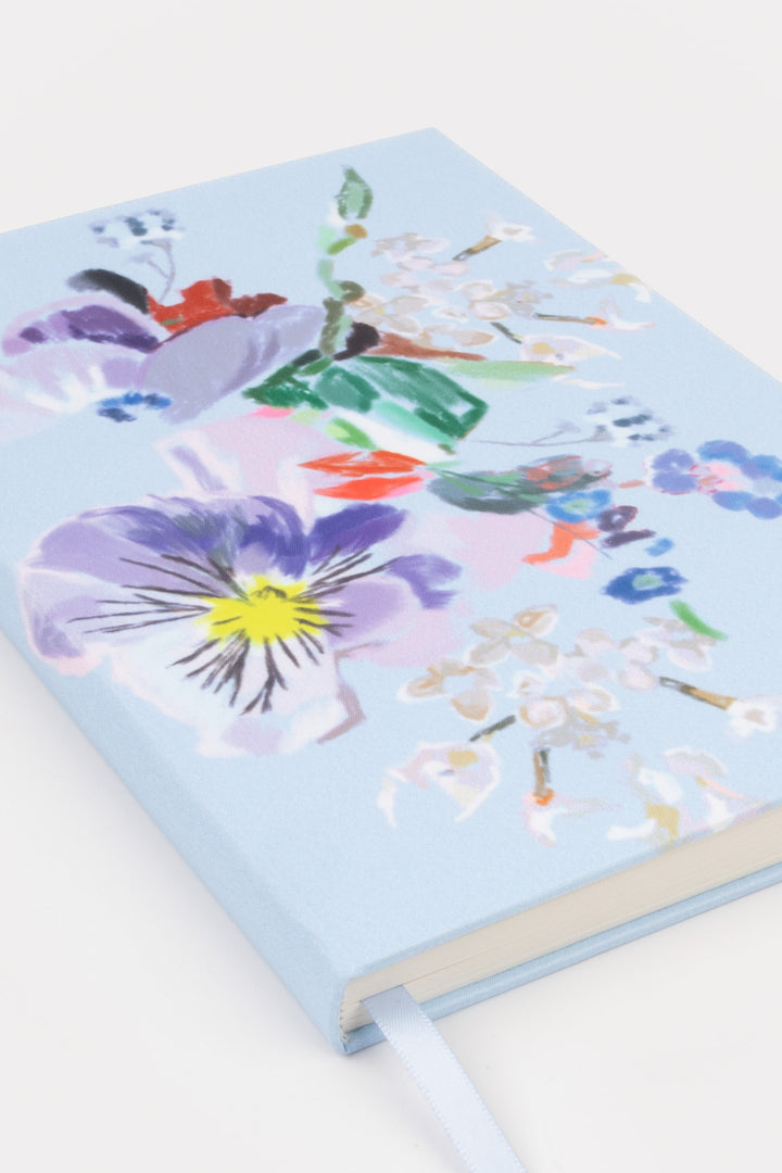 Notebook with floral design on a light blue cover