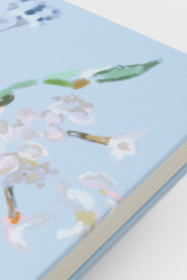 Notebook with floral design on a light blue cover