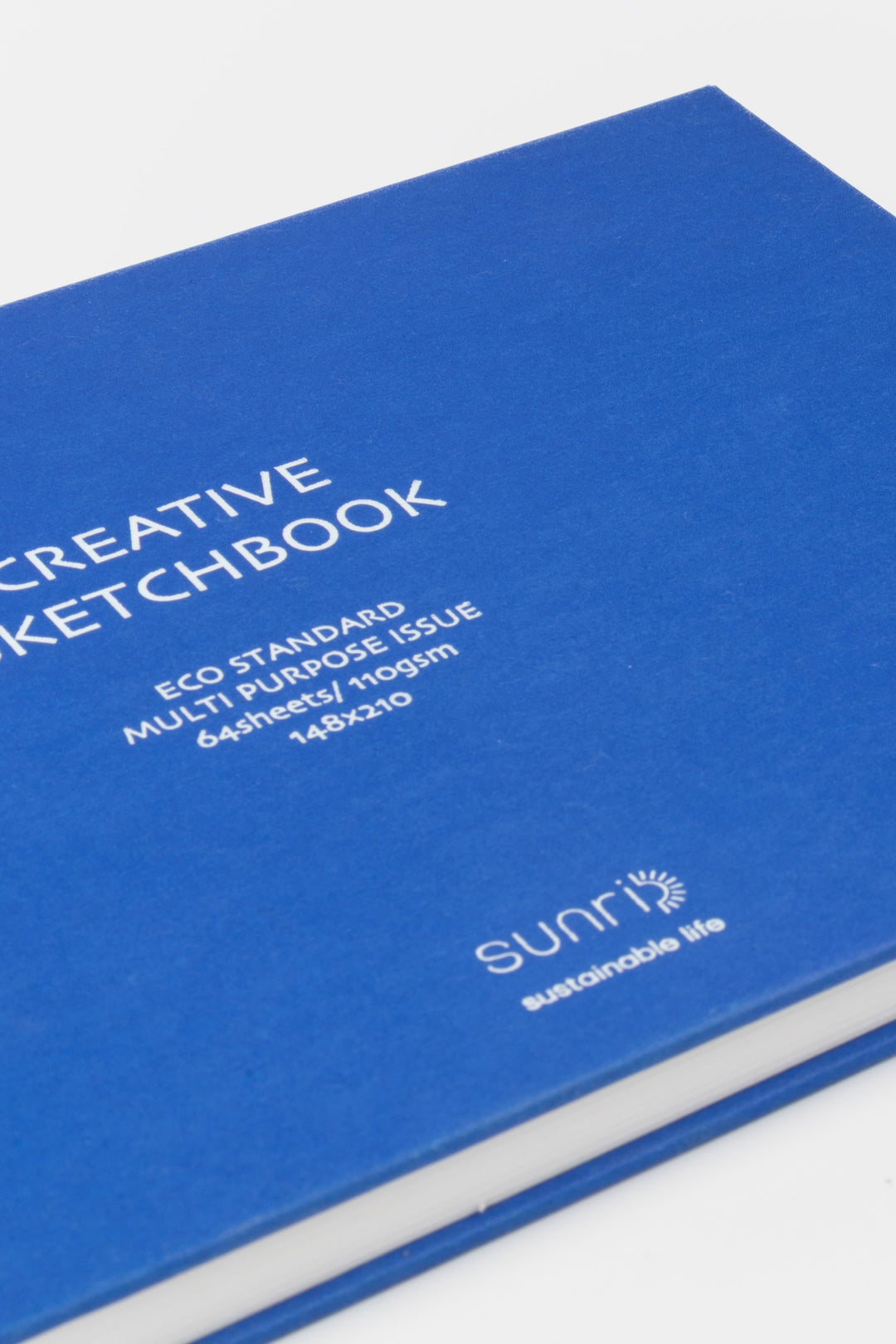 close up of the blue sketchbook cover with white printed title