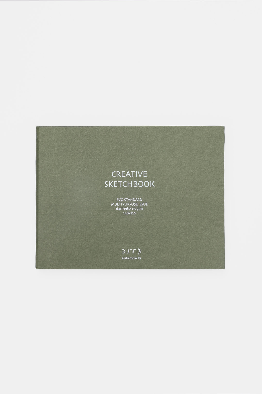 green landscape sketchbook closed with white title on the cover